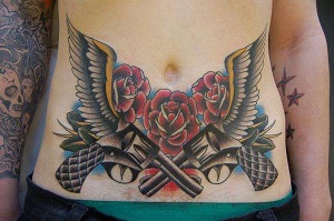 Stomach-Tattoos-guns-pistols-roses.jpeg